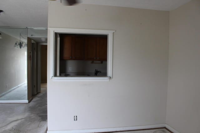 spare room with concrete flooring and a textured ceiling