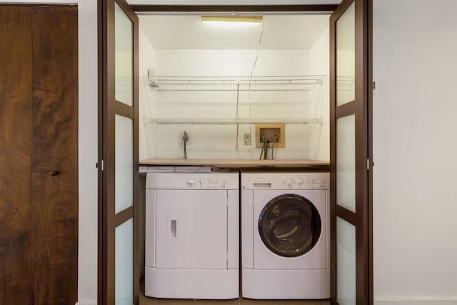 washroom with washer and clothes dryer