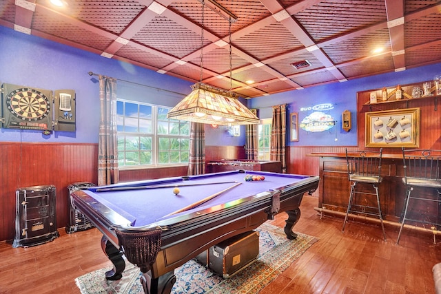 playroom featuring hardwood / wood-style flooring, bar, and wooden walls