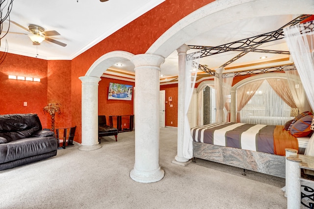 bedroom featuring crown molding, decorative columns, and carpet