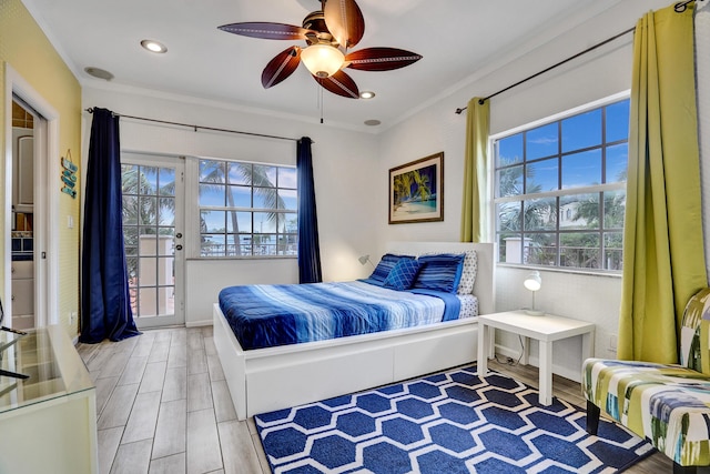 bedroom featuring ceiling fan, access to outside, and multiple windows