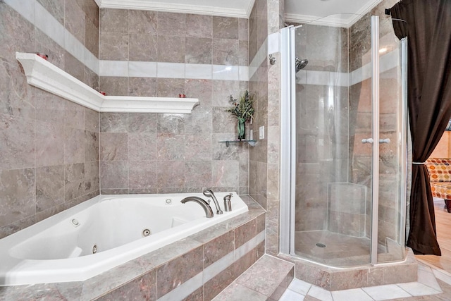 bathroom featuring separate shower and tub and ornamental molding