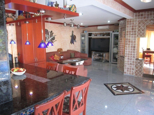 kitchen with crown molding and a wall mounted AC