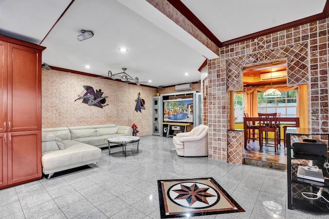 living room with an AC wall unit and ornamental molding