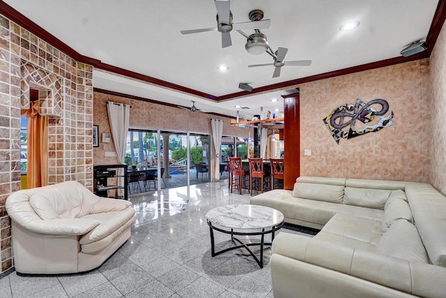 living room featuring ceiling fan and ornamental molding