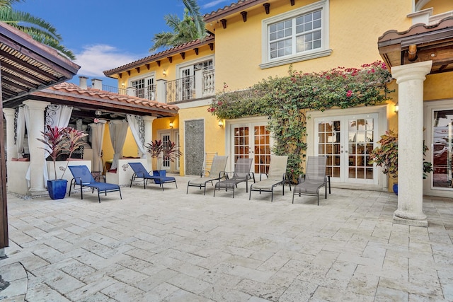 back of property featuring a patio and french doors