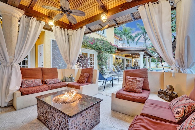 exterior space with beamed ceiling, ceiling fan, and wood ceiling