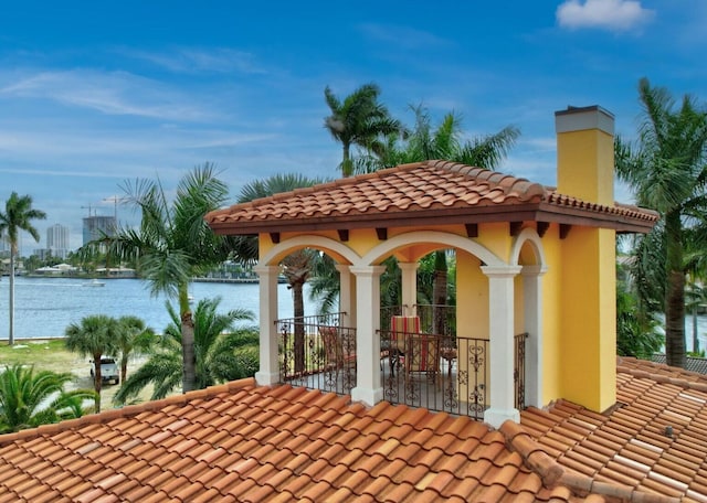 view of patio featuring a water view and a gazebo