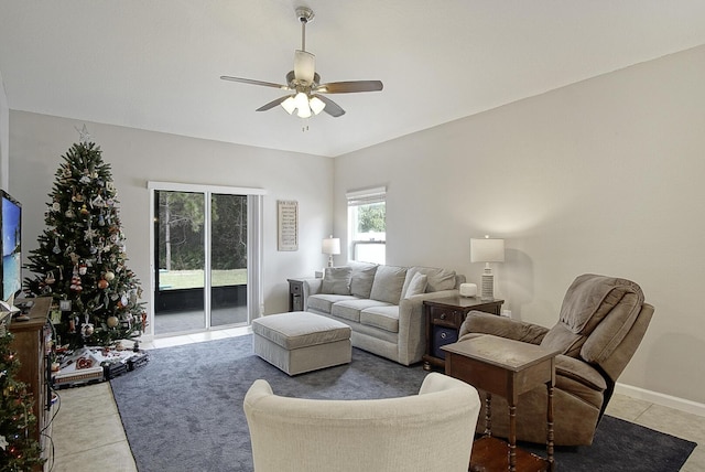 living room with ceiling fan and light tile patterned floors