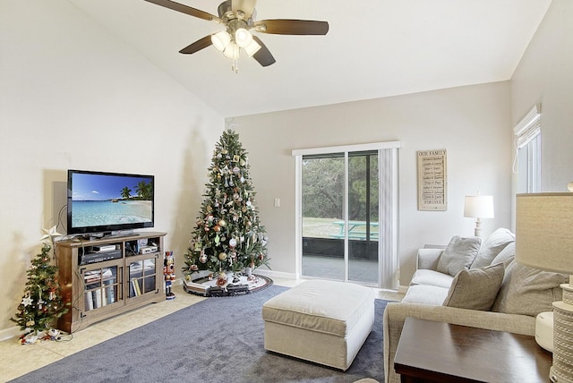 tiled living room with ceiling fan and vaulted ceiling