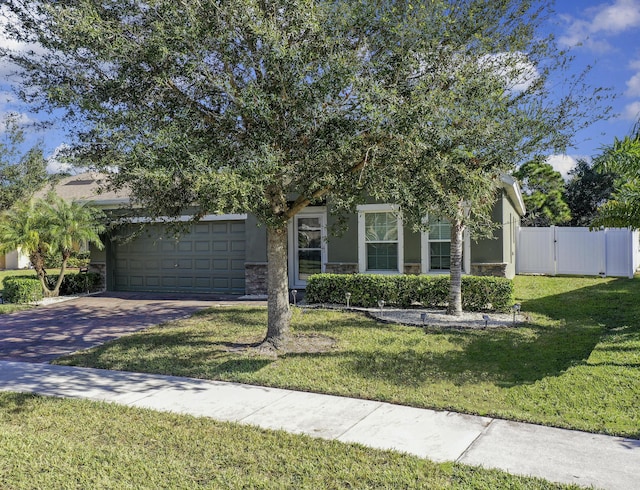 obstructed view of property featuring a front lawn