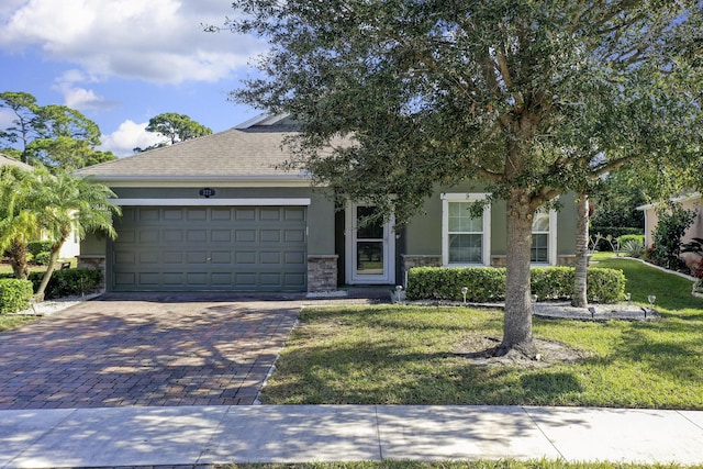 view of front facade with a garage and a front yard