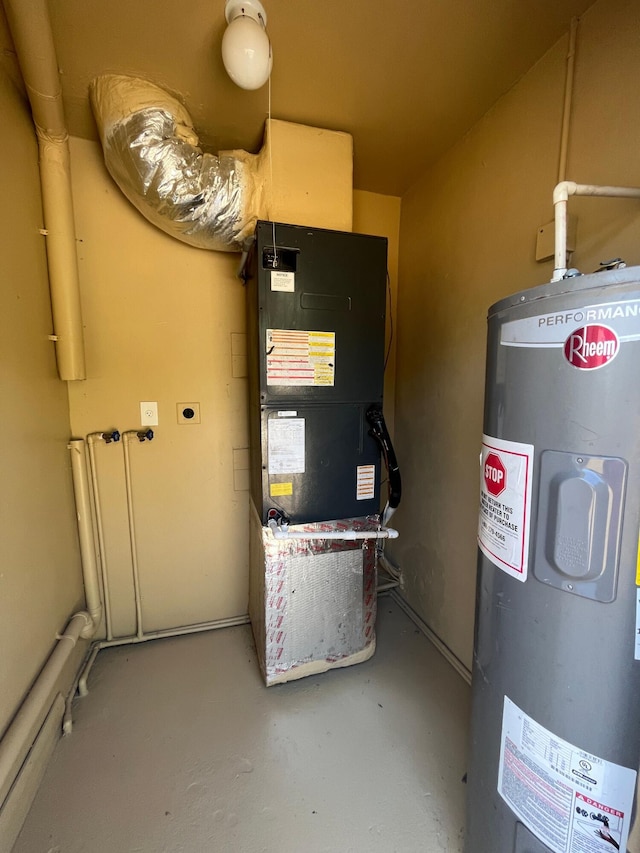 utility room with heating unit and water heater