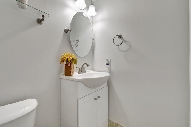 bathroom with vanity and toilet