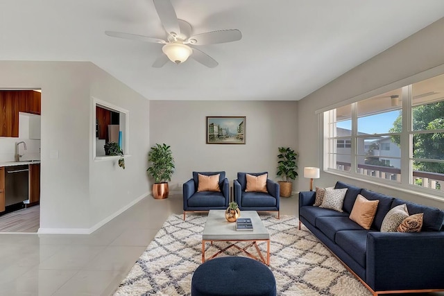 tiled living room featuring sink and ceiling fan