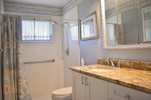 bathroom with a shower with curtain, vanity, and toilet