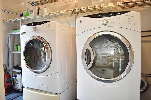 clothes washing area with washer and dryer