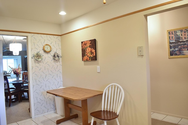 tiled dining area featuring a notable chandelier