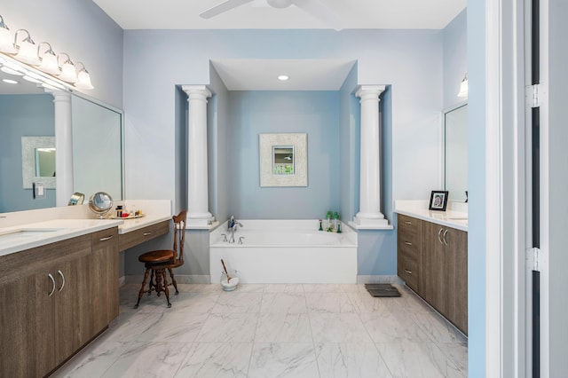 bathroom with a tub to relax in, ceiling fan, and vanity