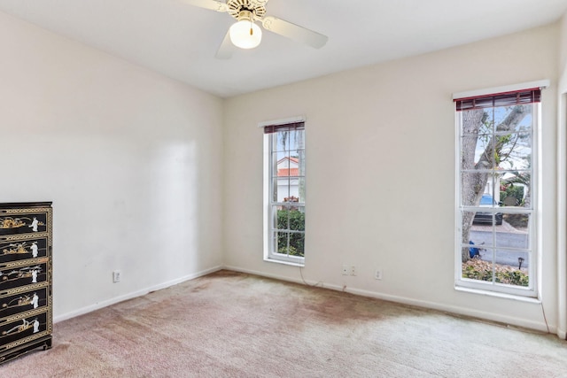 carpeted empty room with ceiling fan