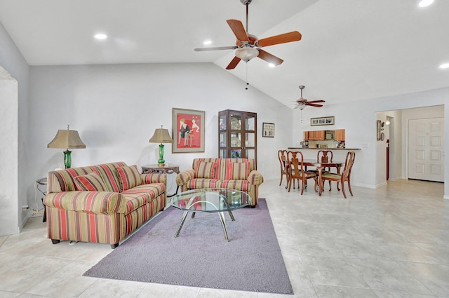 living room featuring ceiling fan, light tile patterned flooring, and vaulted ceiling