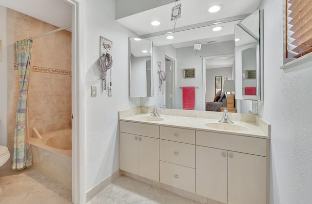 full bathroom featuring tile patterned flooring, shower / tub combo, vanity, and toilet