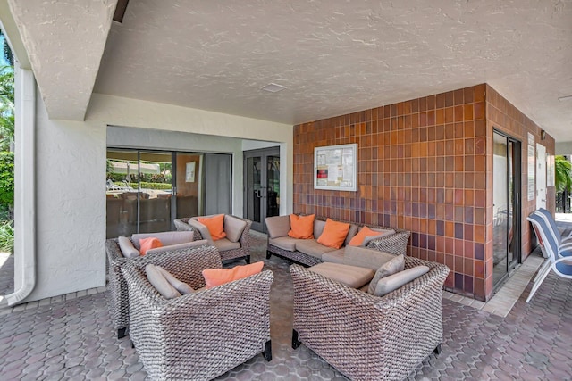 view of patio / terrace featuring an outdoor living space and french doors