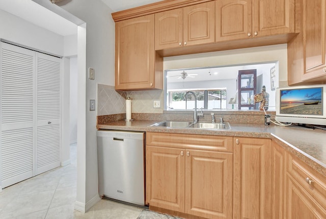 kitchen with ceiling fan, dishwasher, sink, decorative backsplash, and light tile patterned floors