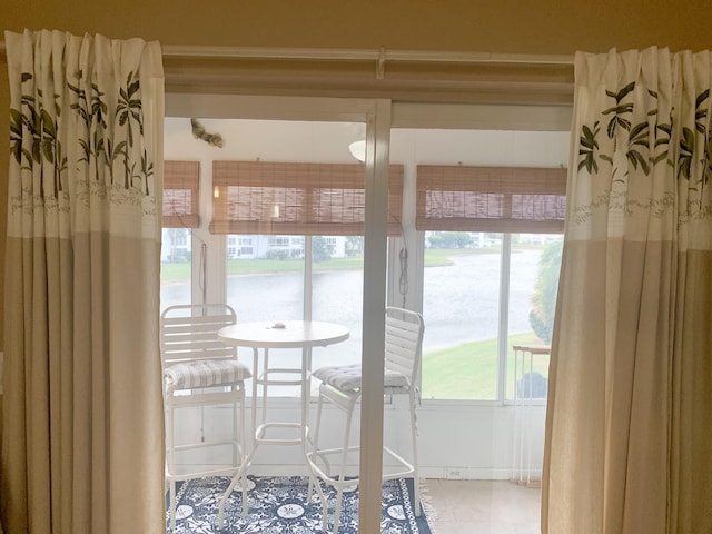 sunroom with a water view