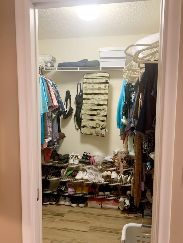 walk in closet featuring wood-type flooring