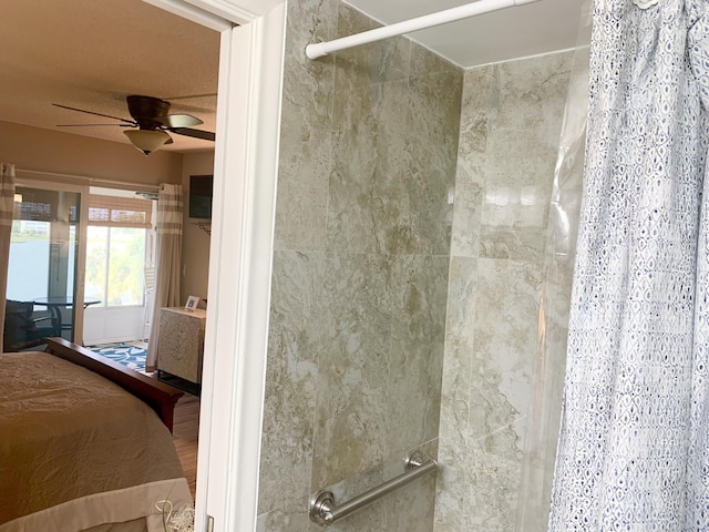 bathroom with a shower with curtain and ceiling fan