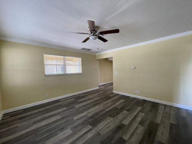 empty room with dark hardwood / wood-style flooring, ceiling fan, and crown molding