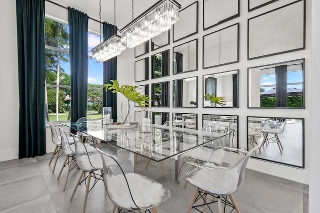 sunroom / solarium featuring a notable chandelier and a healthy amount of sunlight