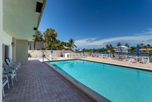 view of swimming pool with a patio area