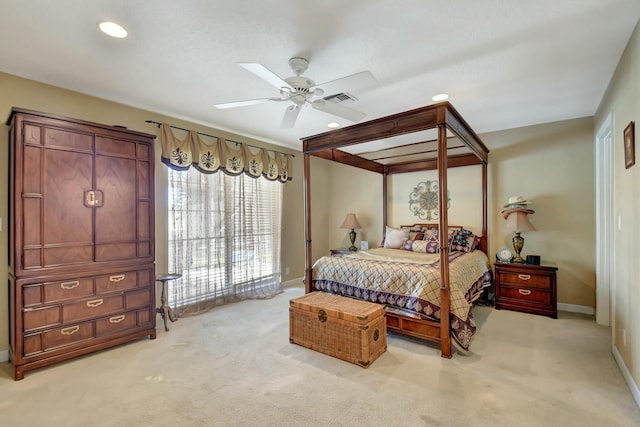 bedroom featuring ceiling fan and light carpet