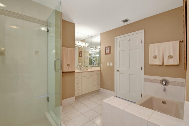 bathroom with shower with separate bathtub, vanity, an inviting chandelier, and tile patterned floors