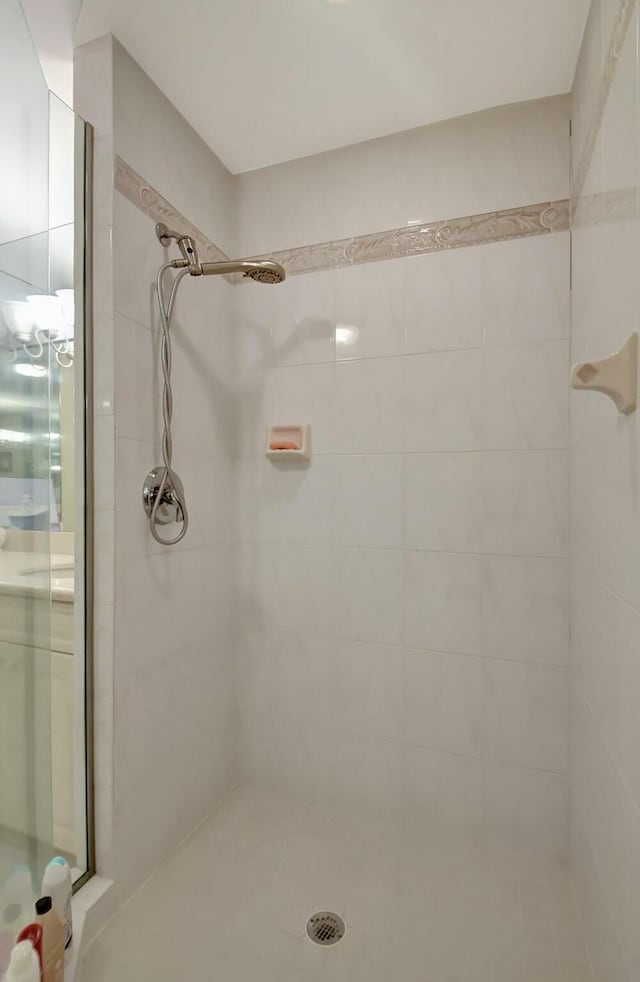 bathroom with tiled shower