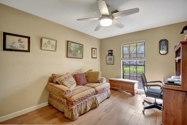 office space with ceiling fan and light hardwood / wood-style floors