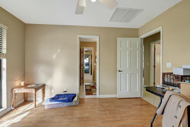 office area with ceiling fan and light hardwood / wood-style flooring