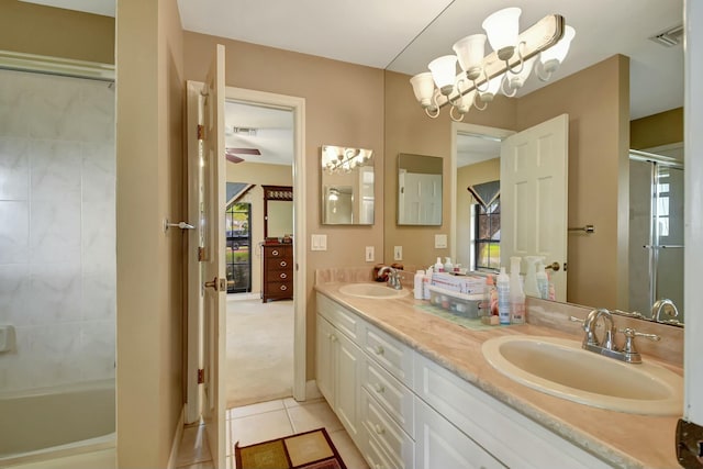 bathroom with tile patterned floors, plenty of natural light, and vanity