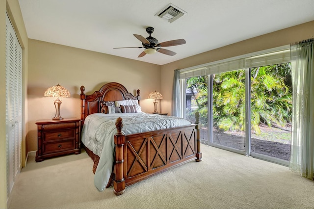 bedroom featuring ceiling fan, light carpet, access to outside, and a closet