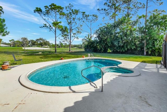 view of swimming pool with a lawn and a patio area