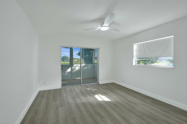 unfurnished room featuring hardwood / wood-style floors and ceiling fan