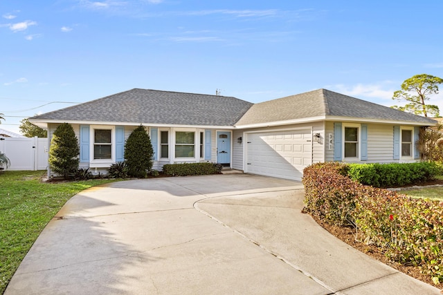 single story home featuring a garage