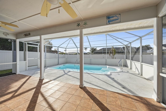 view of swimming pool featuring a lanai and a patio area