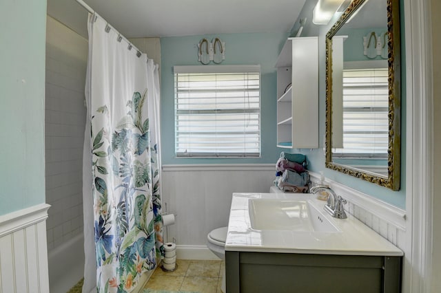 full bathroom featuring vanity, shower / bath combo with shower curtain, tile patterned flooring, toilet, and wood walls