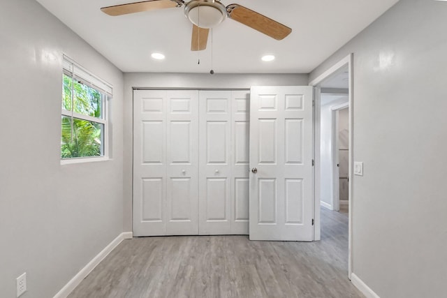 unfurnished bedroom with a closet, ceiling fan, and light hardwood / wood-style floors