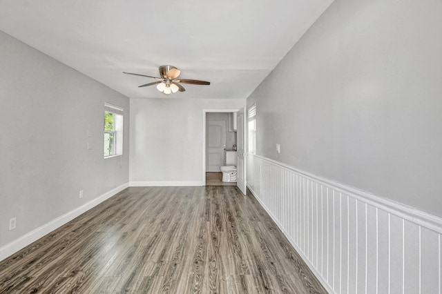 empty room with hardwood / wood-style flooring and ceiling fan