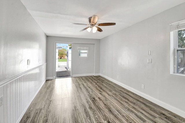 empty room featuring dark hardwood / wood-style floors and ceiling fan