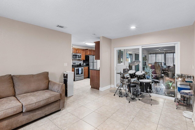 tiled living room with a textured ceiling